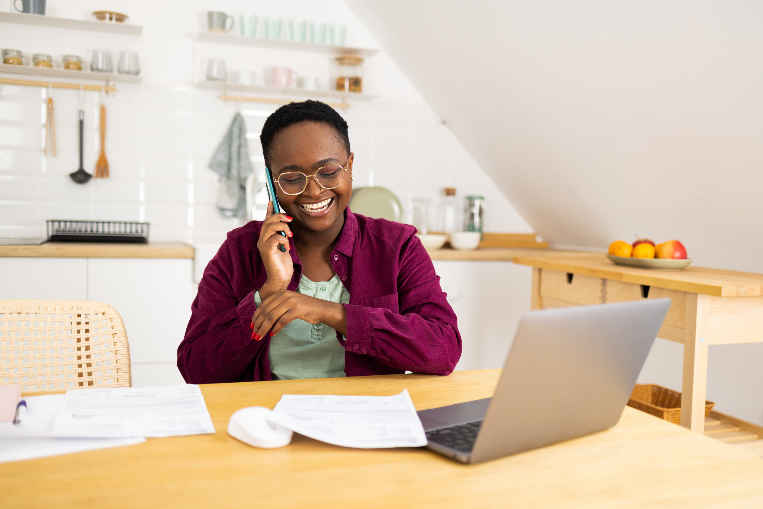 African American businesswoman telephoning with her clients